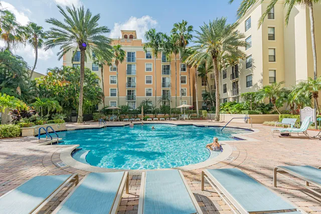 a living room with furniture a fireplace and a table