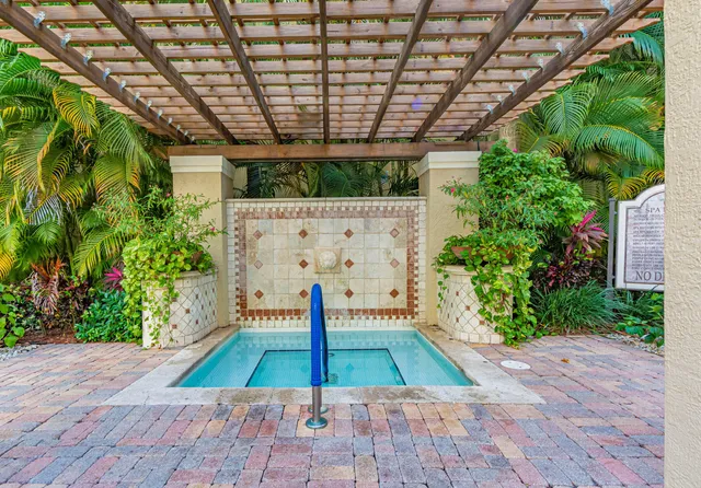a living room with fireplace furniture and a flat screen tv