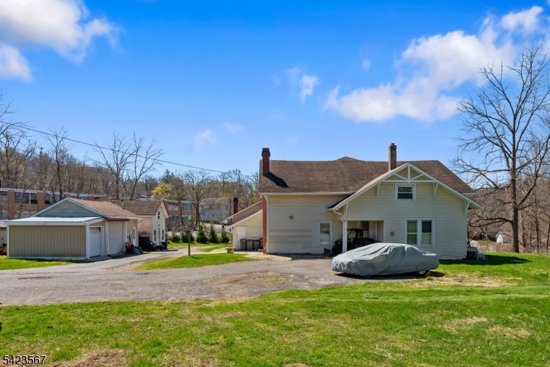 2 Prospect Street Mount Arlington, NJ 07856 - Photo 13 of 24 a front view of a house with a yard and garage