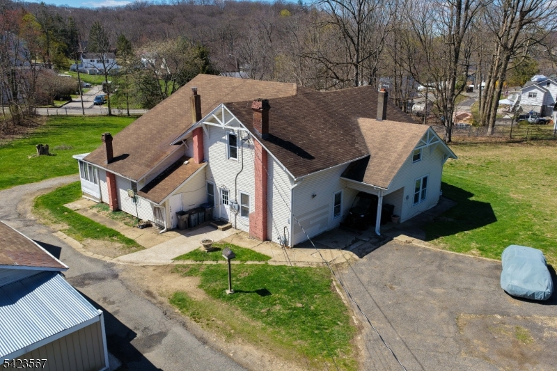 2 Prospect Street Mount Arlington, NJ 07856 - Photo 19 of 24 front view of house with a yard and potted plants