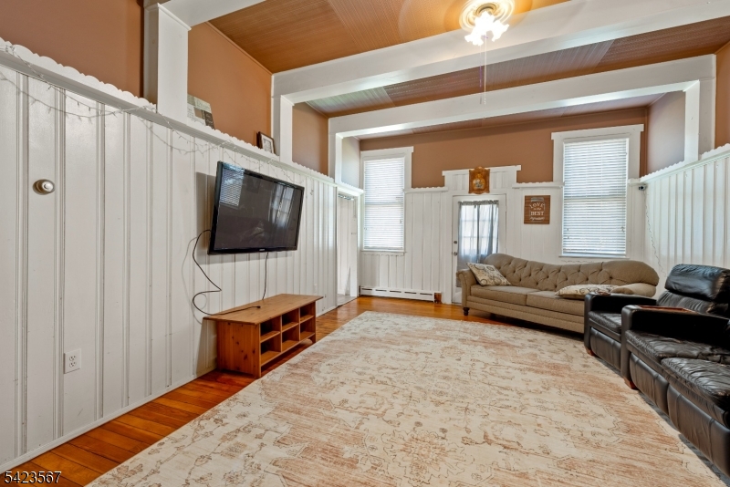 2 Prospect Street Mount Arlington, NJ 07856 - Photo 5 of 24 a living room with furniture and a flat screen tv