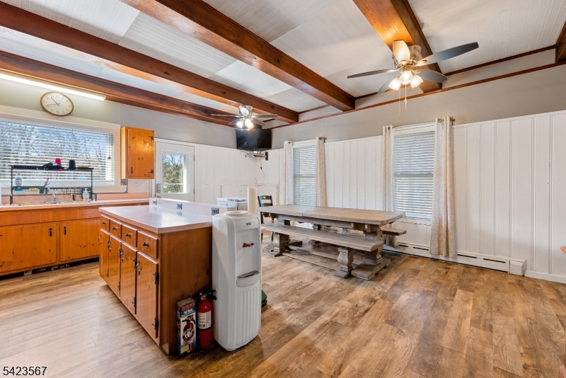 2 Prospect Street Mount Arlington, NJ 07856 - Photo 7 of 24 a kitchen with a stove a refrigerator and wooden cabinets