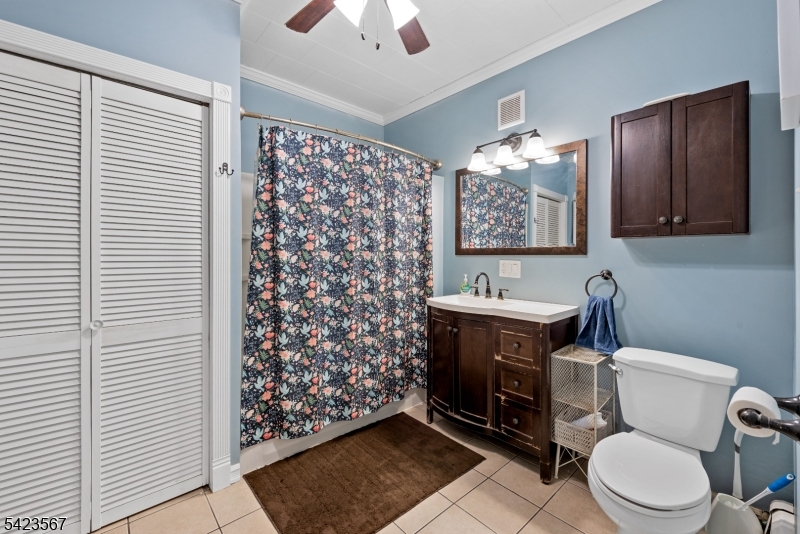 2 Prospect Street Mount Arlington, NJ 07856 - Photo 10 of 24 a bathroom with a toilet a sink and mirror