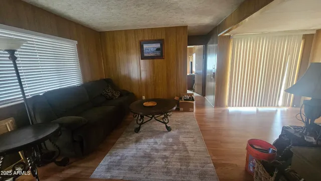 a room with wooden floor and furniture