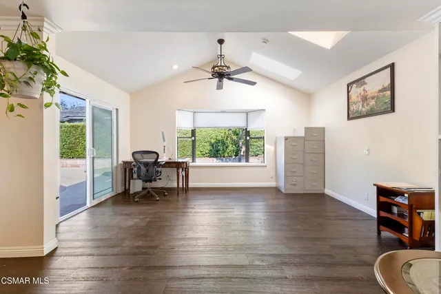 a view of a livingroom with furniture window and wooden floor