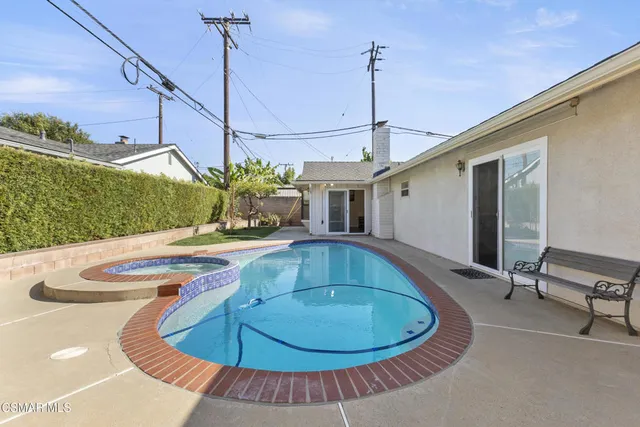 a view of a swimming pool with a patio