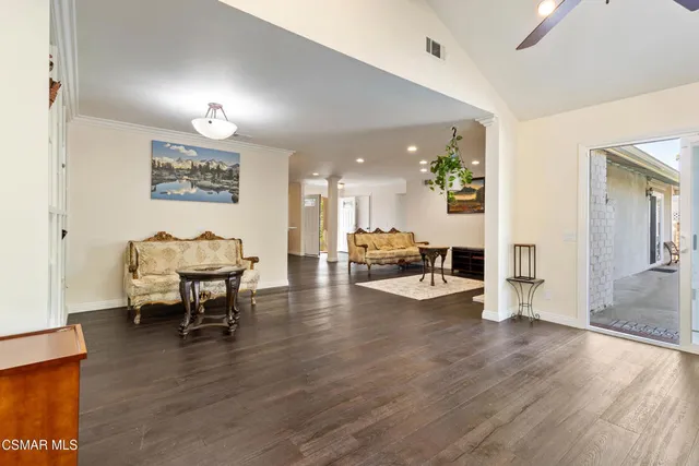 a view of a living room and dining room