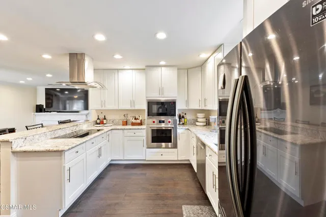 a kitchen with a sink and refrigerator