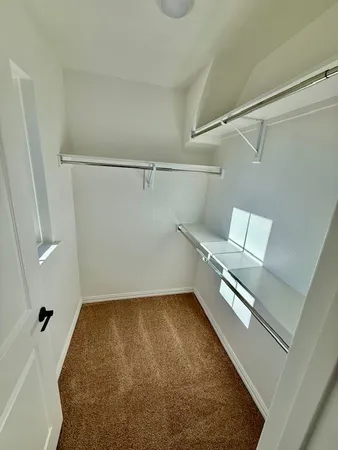 a view of a room with racks on the wall