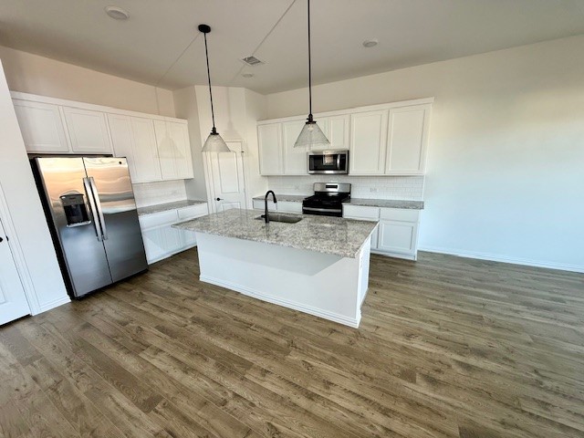 1602 Grassy Pond Road Forney, TX 75126 - Photo 6 of 21 a large kitchen with stainless steel appliances a large counter top a stove a sink and a refrigerator