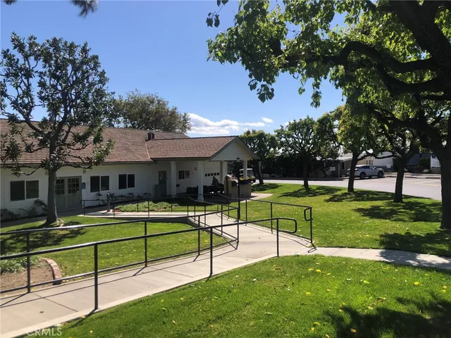 a house view with a sitting space and garden