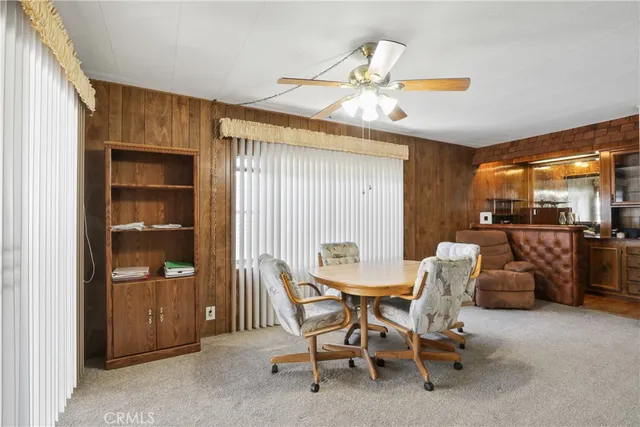 a dining room with furniture and chandelier