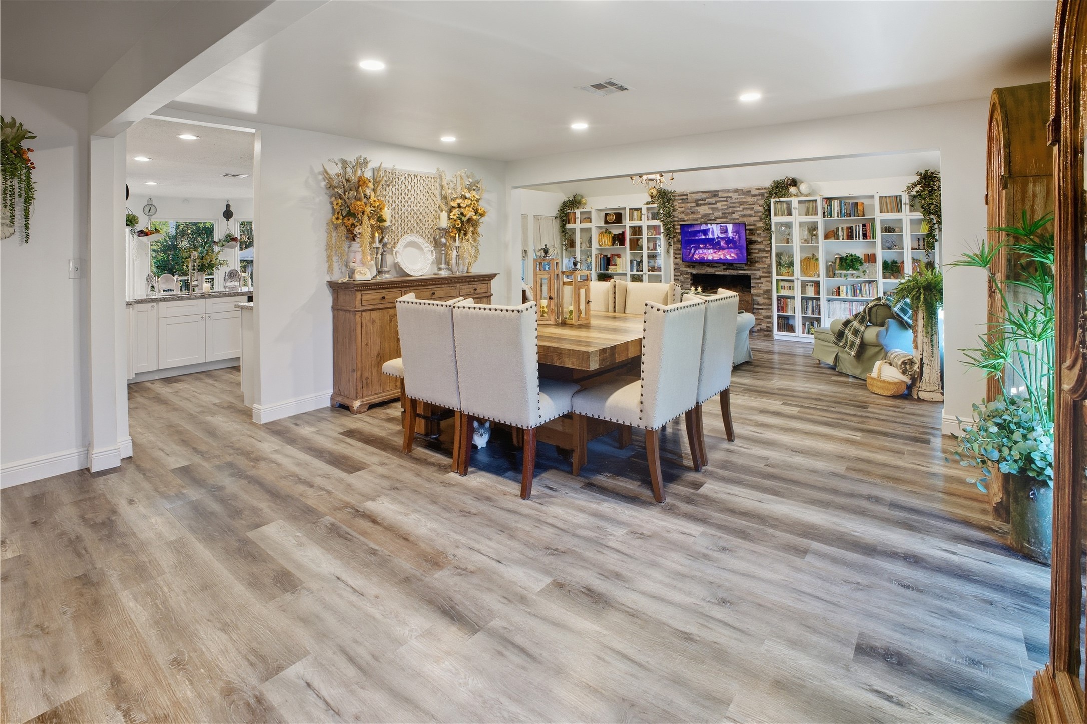 24107 Norchester Way Spring, TX 77389 - Photo 4 of 33 a view of a dining room with furniture and wooden floor
