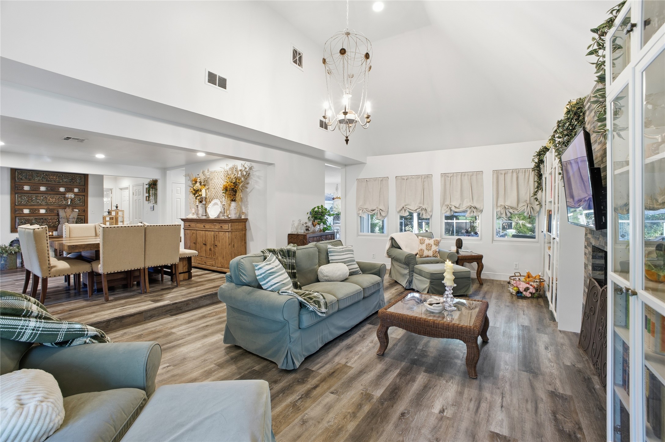 24107 Norchester Way Spring, TX 77389 - Photo 7 of 33 a living room with furniture or couch and a chandelier