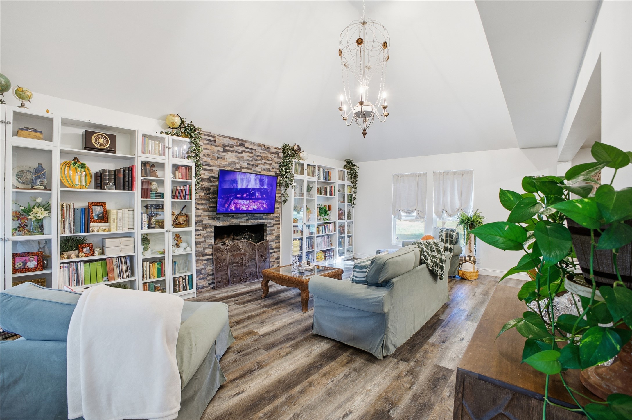 24107 Norchester Way Spring, TX 77389 - Photo 8 of 33 a living room with patio furniture and a flat screen tv