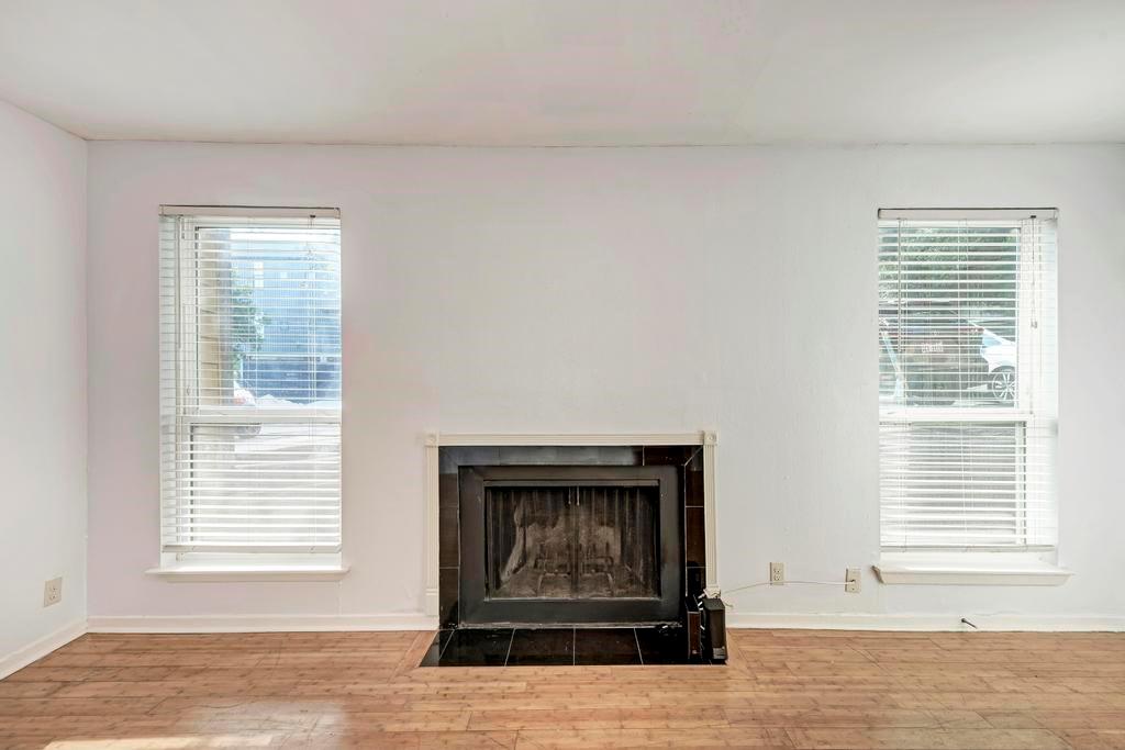 1000 West 26th Street, Unit 113 Austin, TX 78705 - Photo 3 of 10 a view of an empty room with a window and fire place