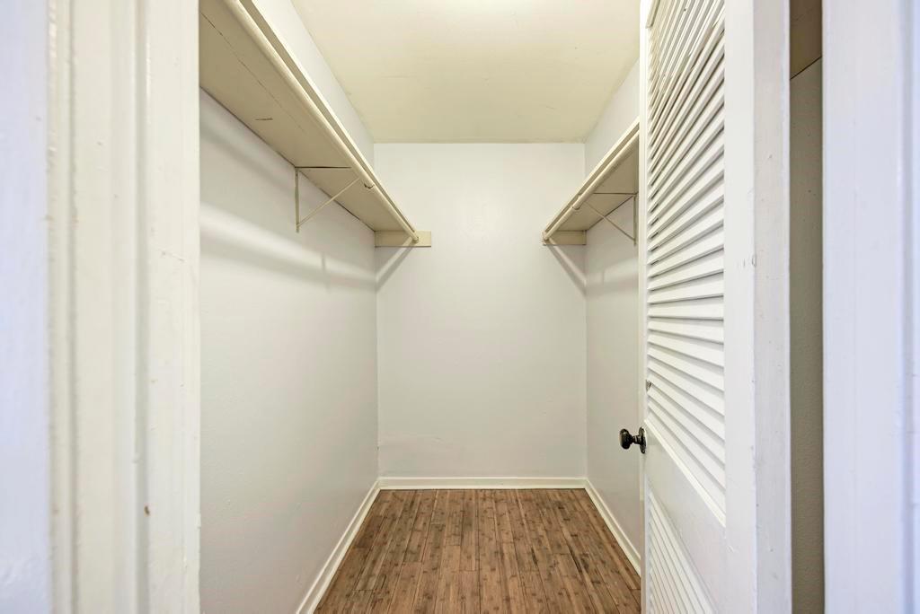 1000 West 26th Street, Unit 113 Austin, TX 78705 - Photo 6 of 10 a view of a room with wooden floor and staircase