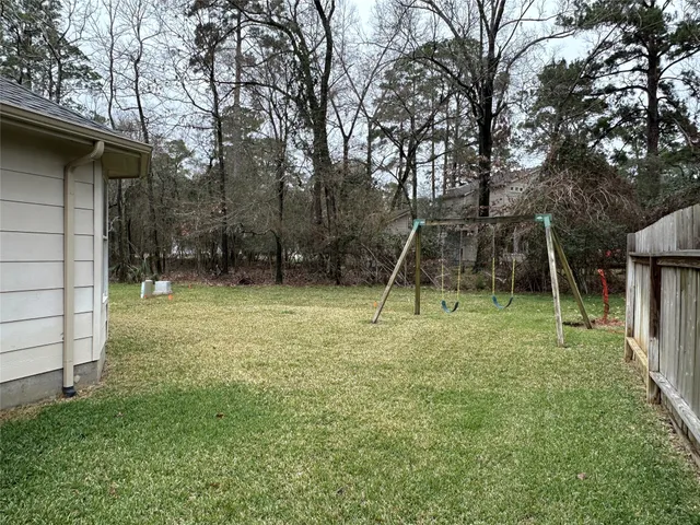 a backyard of a house with lots of green space