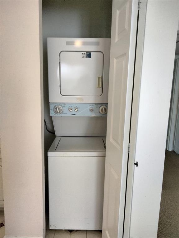 278 Flanders F, Unit F Delray Beach, FL 33484 - Photo 3 of 13 a utility room with dryer and washer