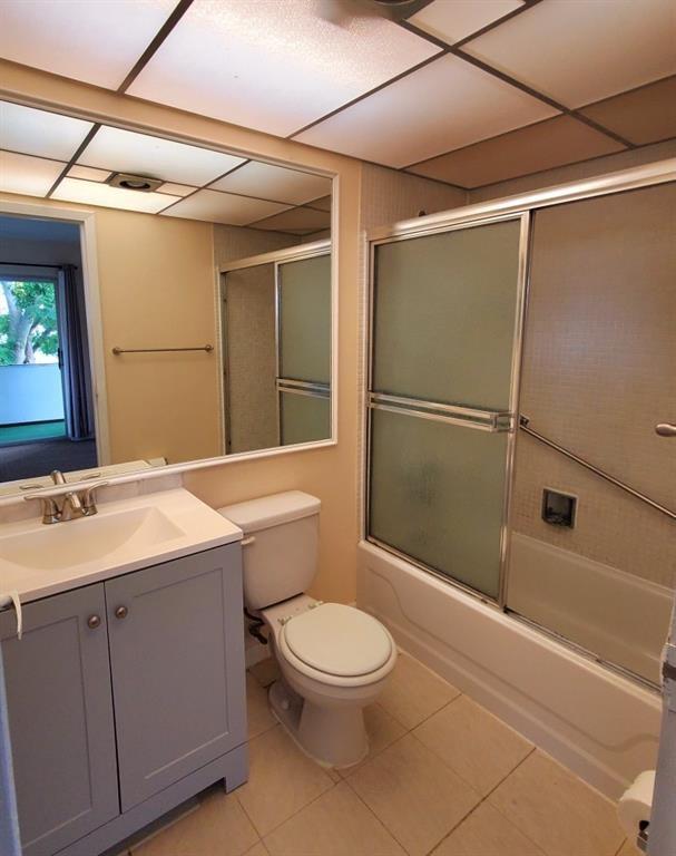 278 Flanders F, Unit F Delray Beach, FL 33484 - Photo 6 of 13 a bathroom with a toilet a sink and shower