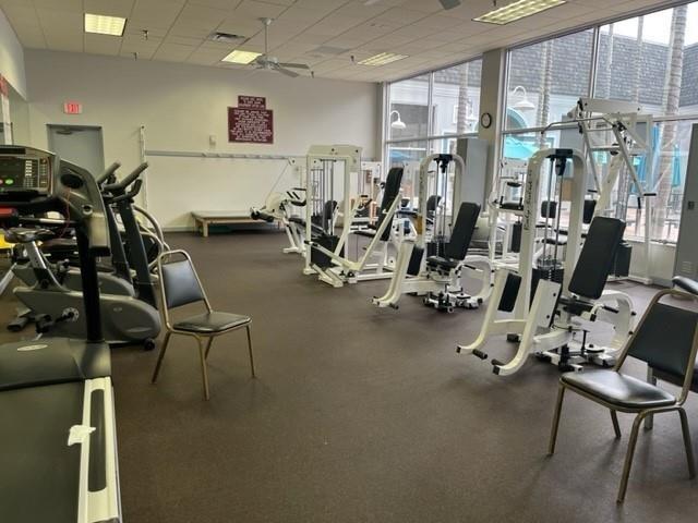 278 Flanders F, Unit F Delray Beach, FL 33484 - Photo 9 of 11 a view of a room with gym equipment