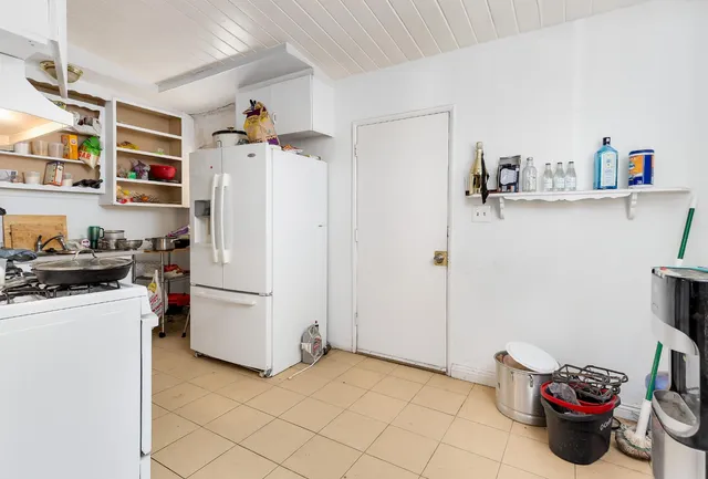 a view of a kitchen with appliances and cabinets