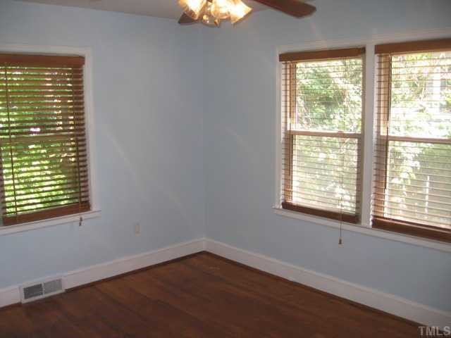1826 Forest Road Durham, NC 27705 - Photo 11 of 12 The third bedroom is also flooded with natural light and has a ceiling fan. great closet storage and great colors will make this someones favorite room in the house! Bedroom