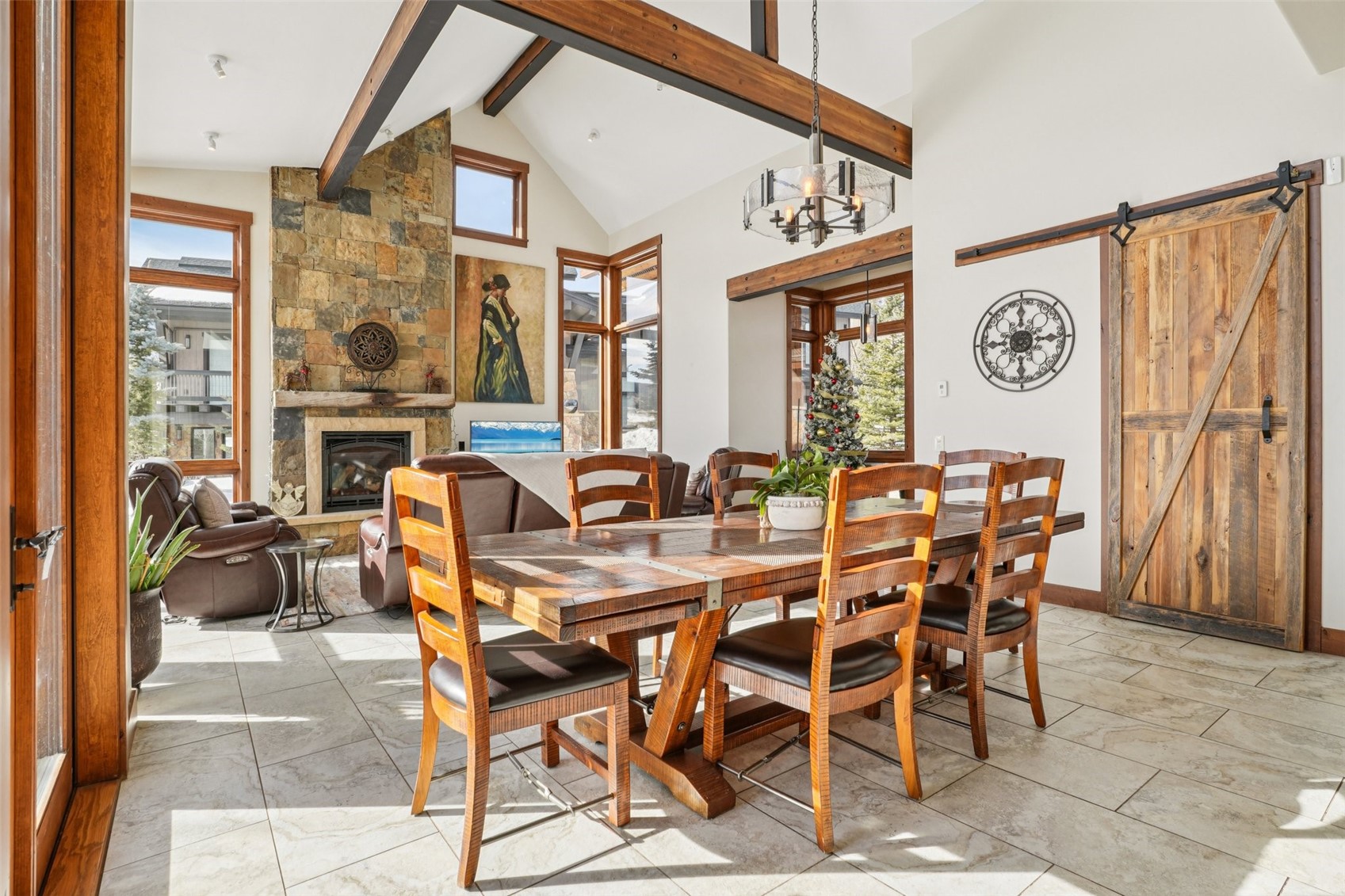 104 Talon Circle Silverthorne, CO 80498 - Photo 15 of 50 a view of a dining room and livingroom furniture wooden floor a rug a painting and a chandelier