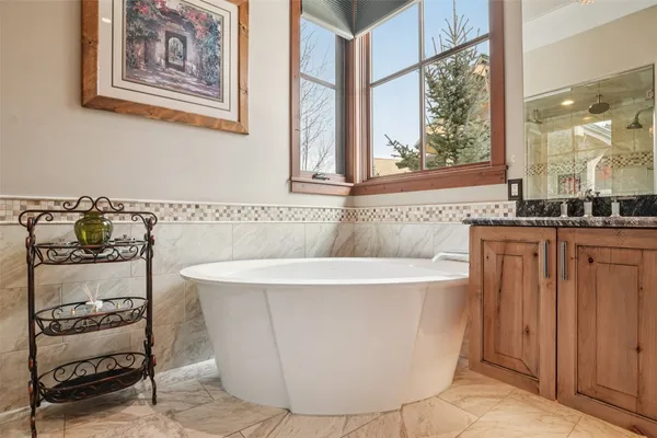 a bathroom with a bathtub and a sink