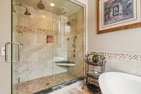 a bathroom with a toilet and shower