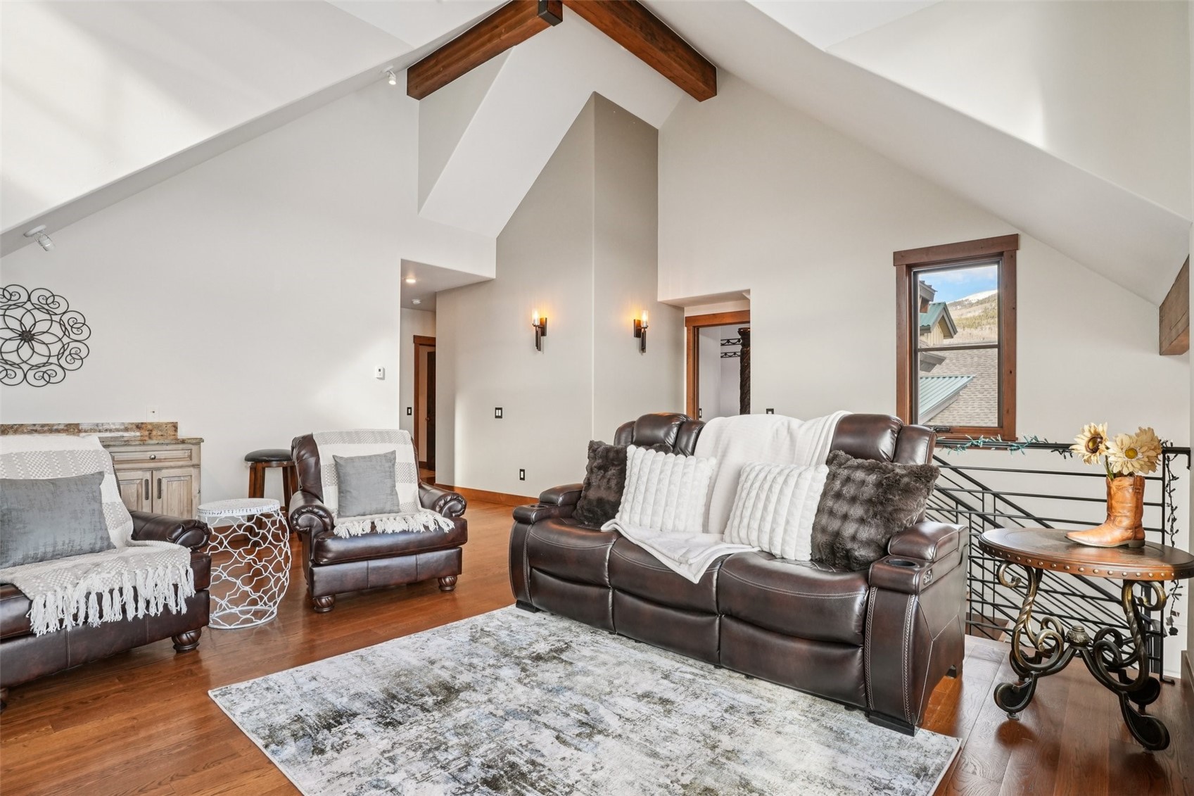 104 Talon Circle Silverthorne, CO 80498 - Photo 29 of 50 a living room with furniture and a wooden floor