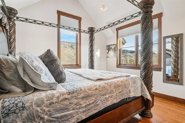 a bedroom with a bed window and walk in closet