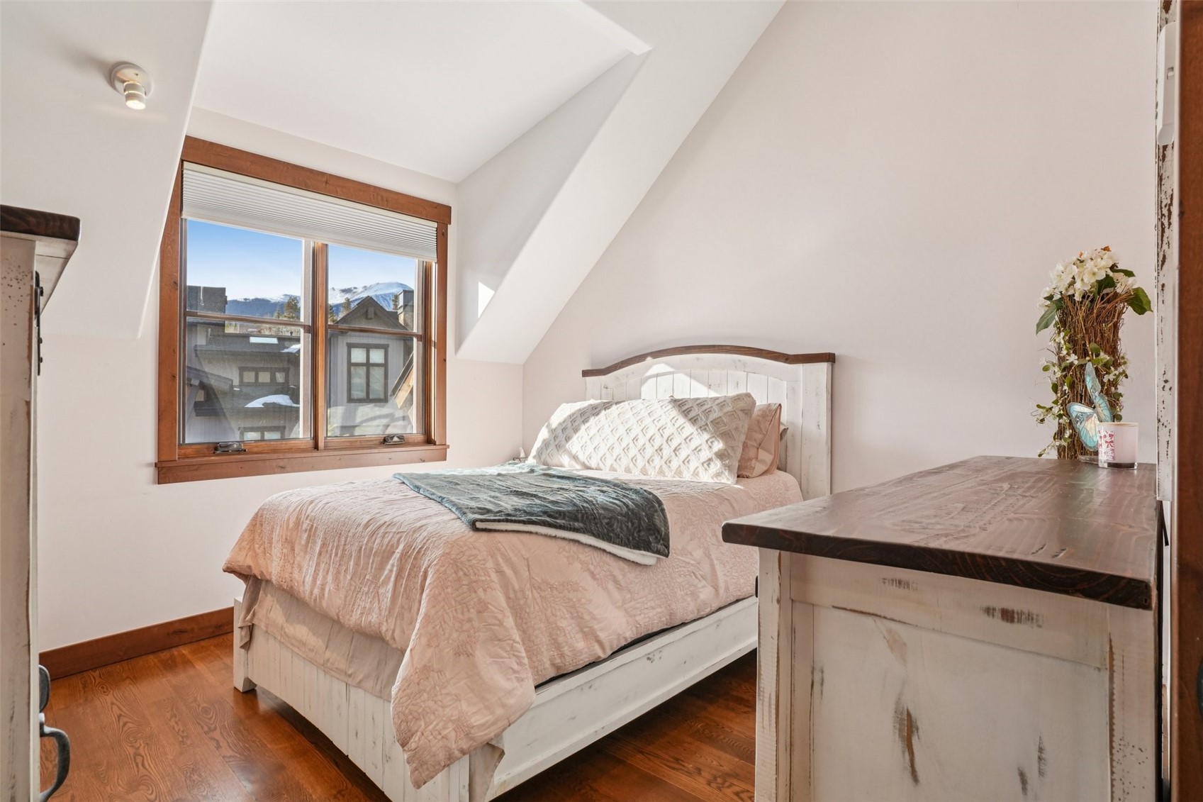 104 Talon Circle Silverthorne, CO 80498 - Photo 35 of 50 a bedroom with a bed and window