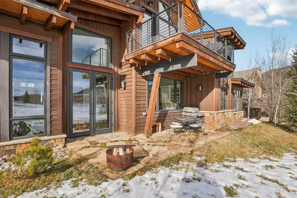 a view of a house with a snow in the background