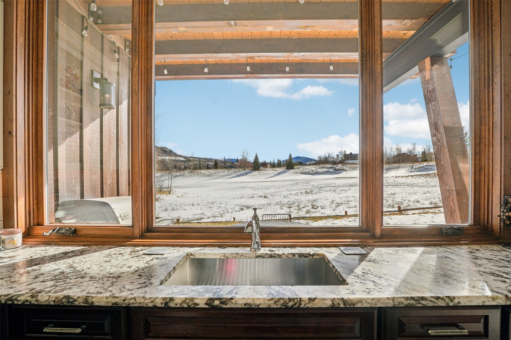104 Talon Circle Silverthorne, CO 80498 - Photo 9 of 50 a view of a granite countertop sink and a window
