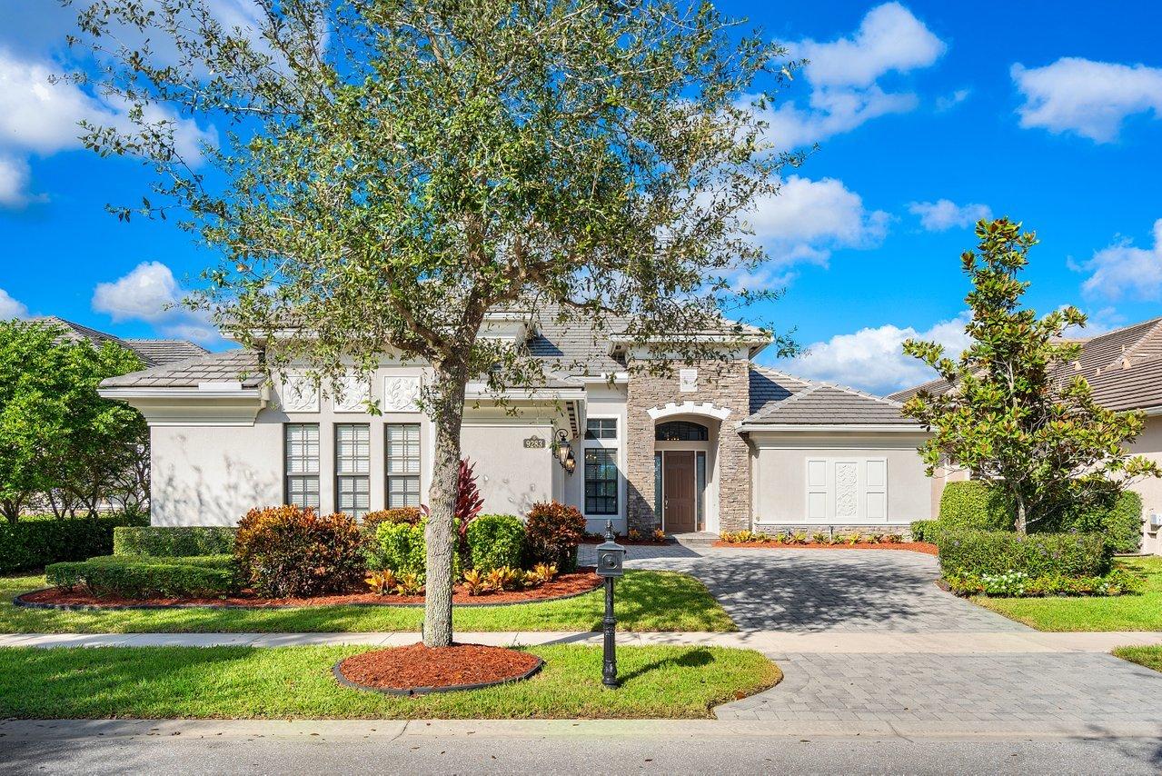 9283 Equus Circle Boynton Beach, FL 33472 - Photo 29 of 48 a front view of a house with a garden and tree