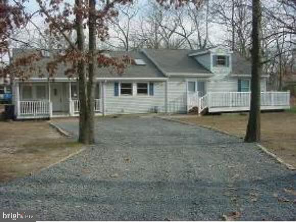 129 Breton Road Brick, NJ 08723 - Photo 1 of 8 a front view of a house with a yard