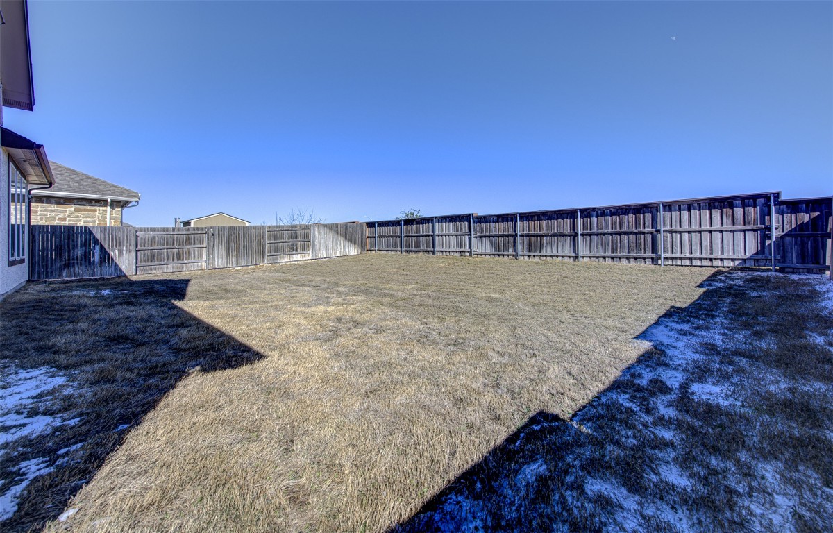 822 Wild Pecan Loop Buda, TX 78610 - Photo 30 of 33 View of fenced backyard