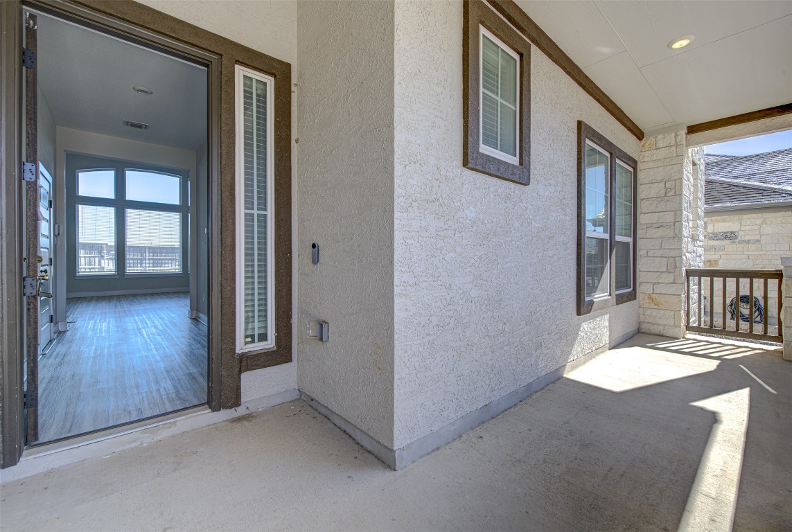 822 Wild Pecan Loop Buda, TX 78610 - Photo 3 of 33 Property entrance with stucco siding