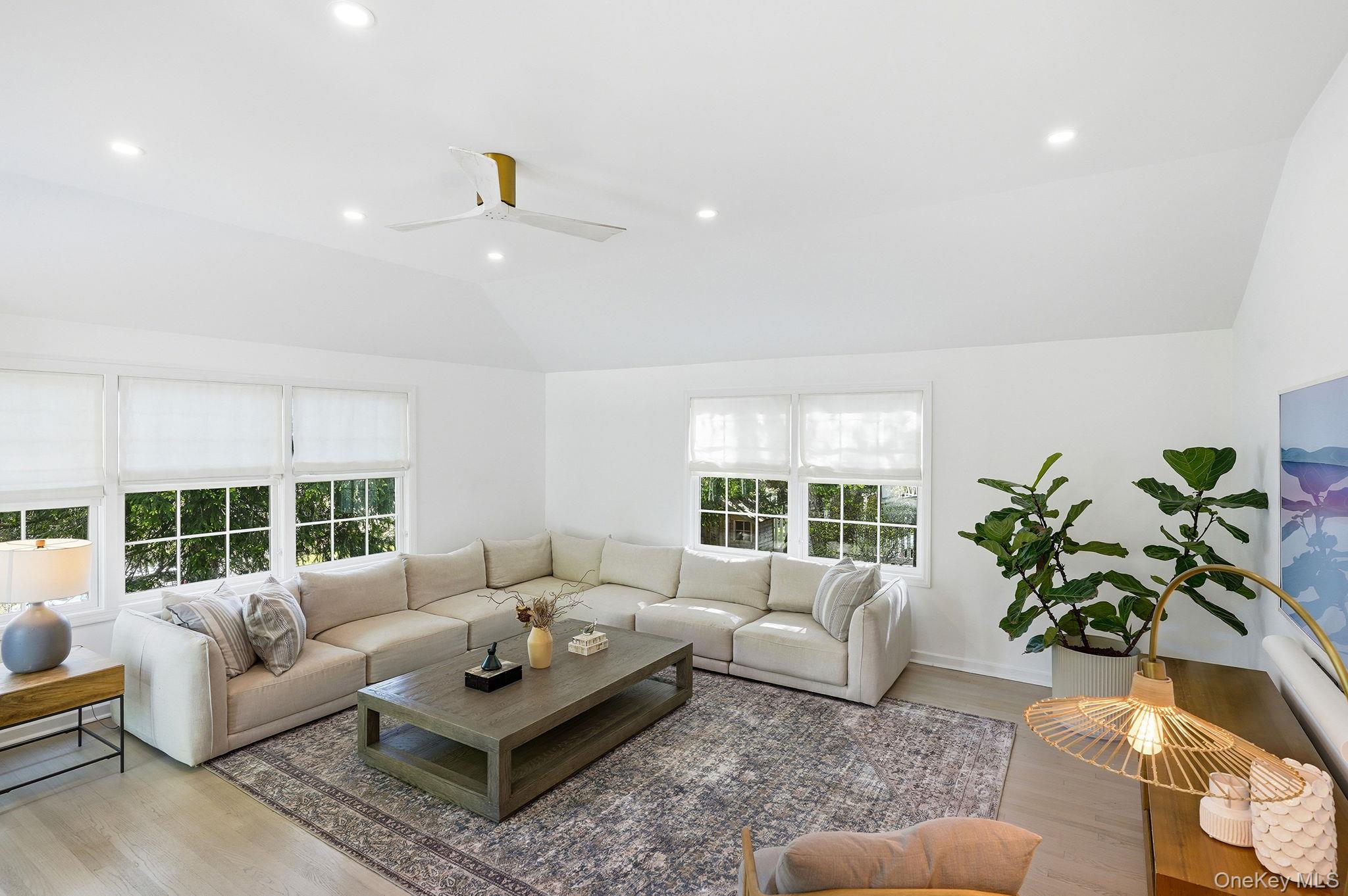 7 Morehead Drive Rye, NY 10580 - Photo 11 of 34 a living room with furniture and a potted plant