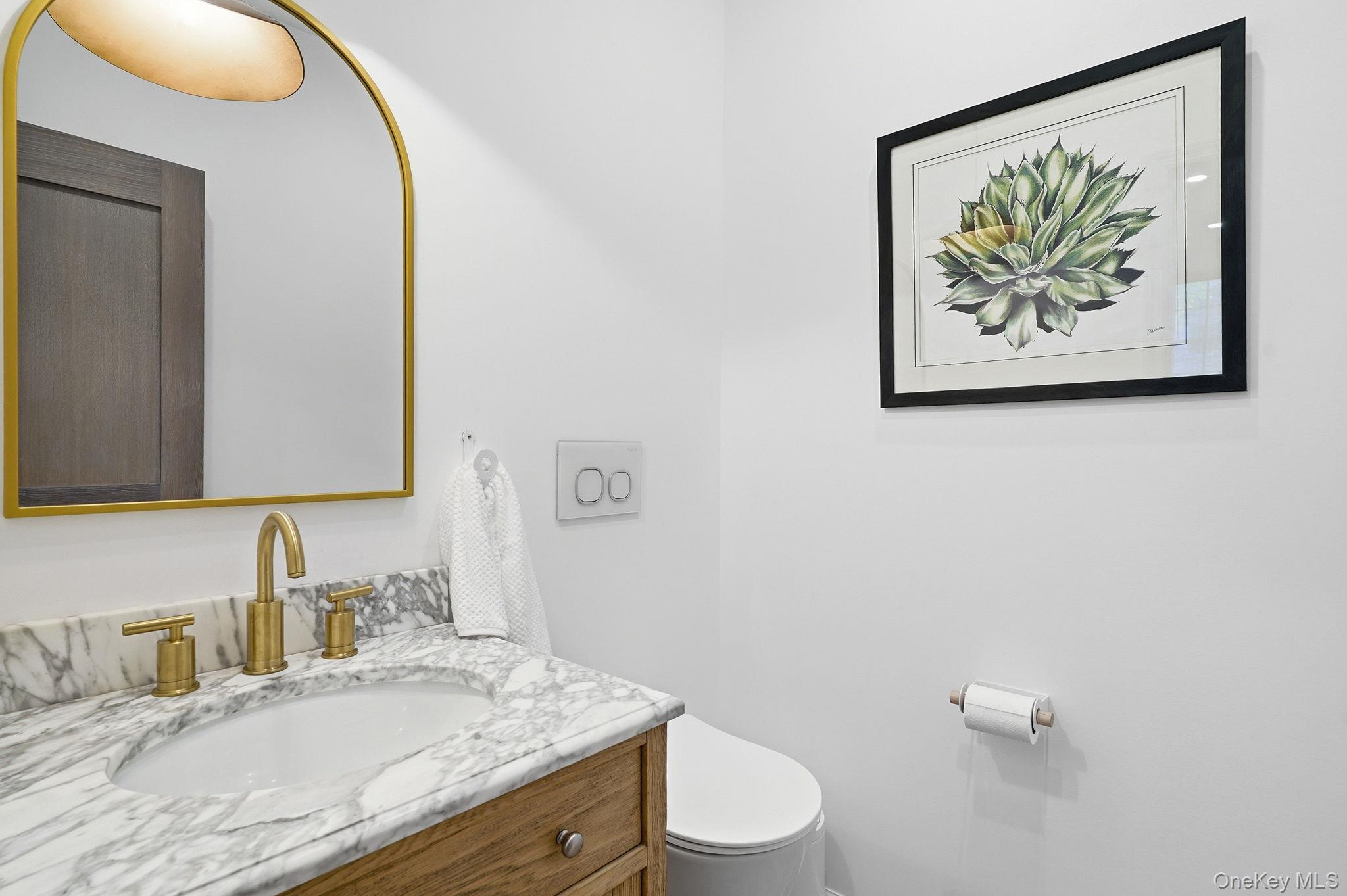 7 Morehead Drive Rye, NY 10580 - Photo 14 of 34 a bathroom with a granite countertop sink mirror vanity and toilet
