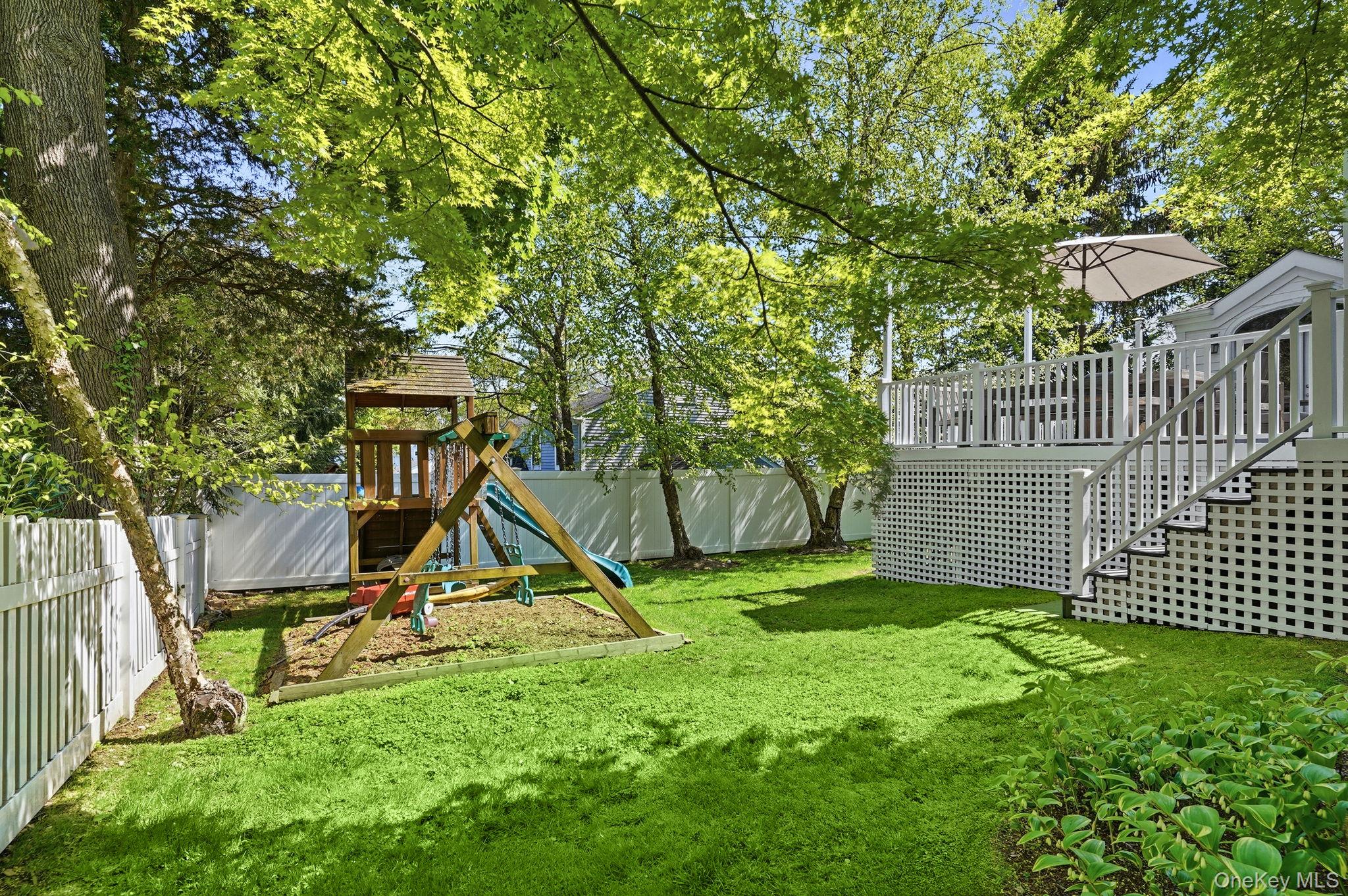 7 Morehead Drive Rye, NY 10580 - Photo 31 of 34 a view of a backyard with a tree