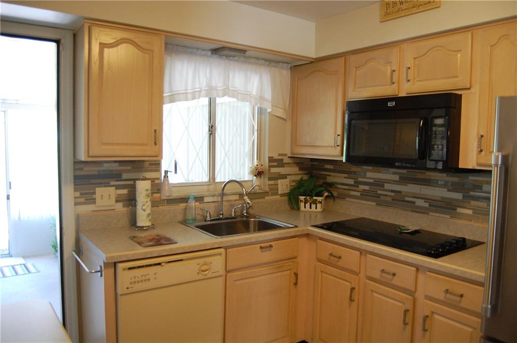 5229 East Willock Road Pittsburgh, PA 15227 - Photo 8 of 21 Bright and open kitchen with door leading into sun room.