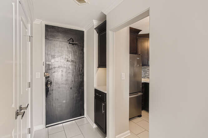 5455 North Sheridan Road, Unit 3105 Chicago, IL 60640 - Photo 3 of 11 a bathroom with a shower and a glass door
