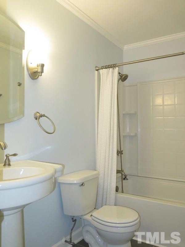 632 Buck Jones Road Raleigh, NC 27606 - Photo 11 of 20 a bathroom with a granite countertop toilet a sink and a mirror