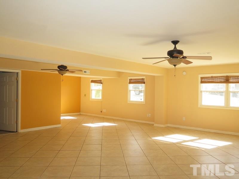 632 Buck Jones Road Raleigh, NC 27606 - Photo 14 of 20 a view of a room with a window and a ceiling fan