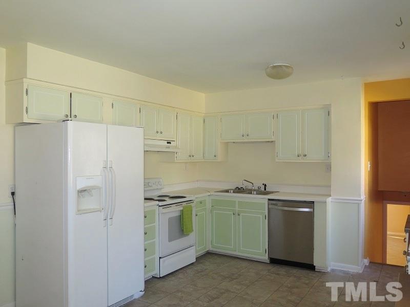632 Buck Jones Road Raleigh, NC 27606 - Photo 4 of 20 a kitchen with stainless steel appliances a refrigerator sink and cabinets