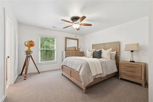 a bed room with a bed and a window