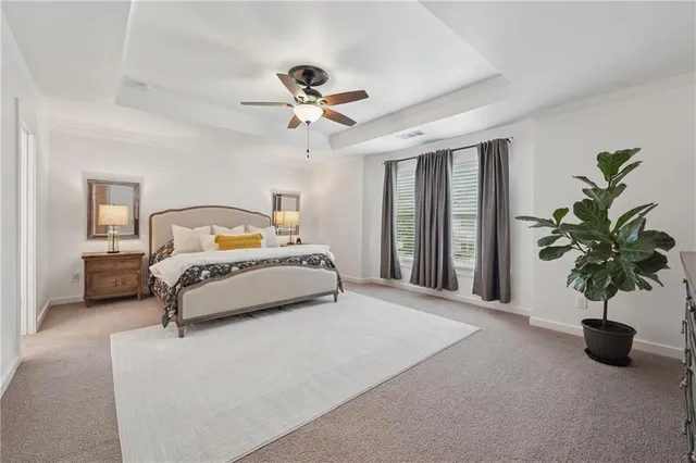 a bedroom with a bed lamp and window
