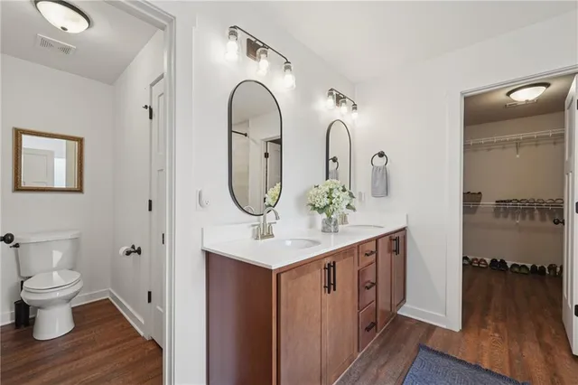a view of bathroom with dual sinks